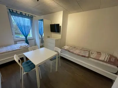 Ein Bett oder Betten in einem Zimmer der Unterkunft Boardinghouse Behrend I