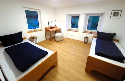 Ein Bett oder Betten in einem Zimmer der Unterkunft Schlossknecht Hohenlohe