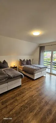 Ein Bett oder Betten in einem Zimmer der Unterkunft Gästehaus Schindhard