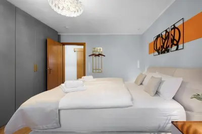 Ein Bett oder Betten in einem Zimmer der Unterkunft The Elegant