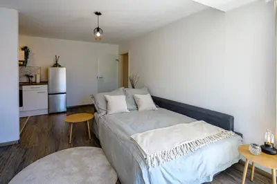 Ein Bett oder Betten in einem Zimmer der Unterkunft Ferienwohnung mit Sonnenbalkon & Parkplatz