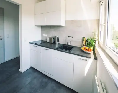 Küche/Küchenzeile in der Unterkunft Vintage Apartment Schwetzingen - 2 Zimmer - Küche, Bad & Balkon