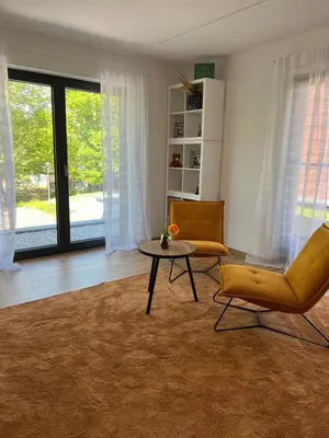 Ein Sitzbereich in der Unterkunft ParkBlick Sulzbach