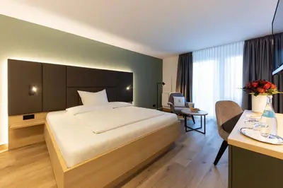 Ein Bett oder Betten in einem Zimmer der Unterkunft Hotel Domizil