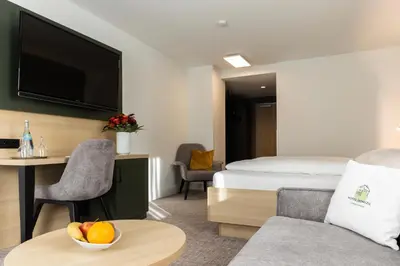 Ein Bett oder Betten in einem Zimmer der Unterkunft Hotel Domizil