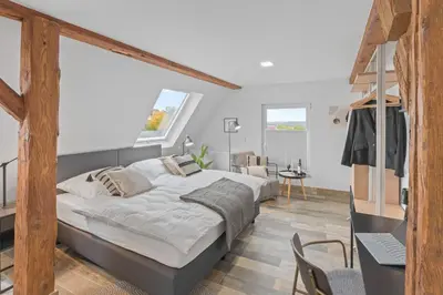 Ein Bett oder Betten in einem Zimmer der Unterkunft RICLS Apartmenthaus Wurmberg - BRIGHT Collection