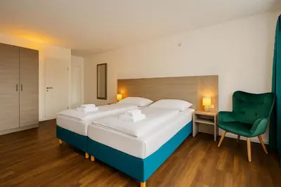 Ein Bett oder Betten in einem Zimmer der Unterkunft AR Boutique Hotel Heusenstamm