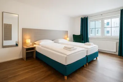 Ein Bett oder Betten in einem Zimmer der Unterkunft AR Boutique Hotel Heusenstamm