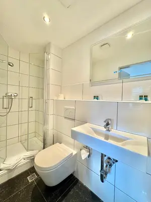 Ein Badezimmer in der Unterkunft AR Boutique Hotel Heusenstamm