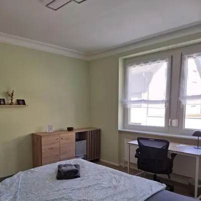 Ein Bett oder Betten in einem Zimmer der Unterkunft Auf der Ried26 - Frisch renoviertes, charmantes Familien-Appartement mit 3 Schlafräumen
