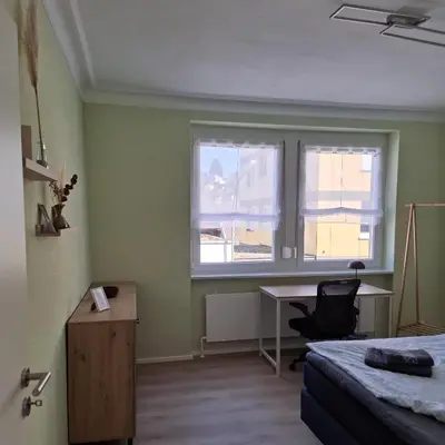 Ein Bett oder Betten in einem Zimmer der Unterkunft Auf der Ried26 - Frisch renoviertes, charmantes Familien-Appartement mit 3 Schlafräumen