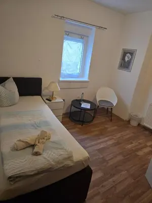 Ein Bett oder Betten in einem Zimmer der Unterkunft Landgasthof Hotel Rebe Alzey