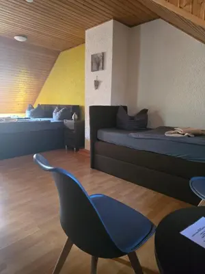 Ein Bett oder Betten in einem Zimmer der Unterkunft Landgasthof Hotel Rebe Alzey