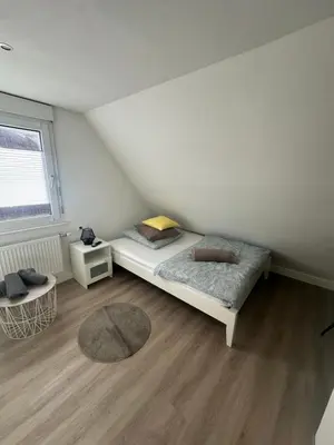 Ein Bett oder Betten in einem Zimmer der Unterkunft NeckarNest Ferienwohnung