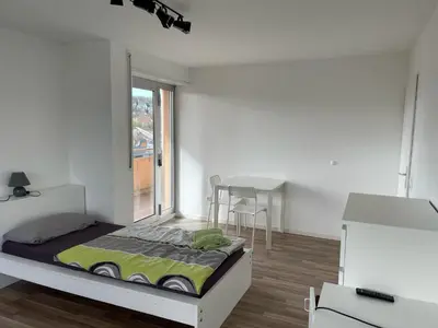 Ein Bett oder Betten in einem Zimmer der Unterkunft Boardinghouse Behrend III