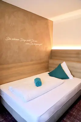 Ein Bett oder Betten in einem Zimmer der Unterkunft Natur & Wander Hotel Gassbachtal