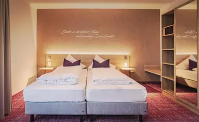 Ein Bett oder Betten in einem Zimmer der Unterkunft Natur & Wander Hotel Gassbachtal