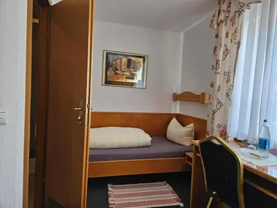 Ein Bett oder Betten in einem Zimmer der Unterkunft Hotel Gasthof Frohmüller