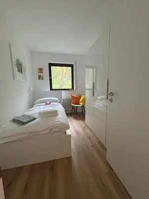 Ein Bett oder Betten in einem Zimmer der Unterkunft Glücks-Quartier Kaffeehof 4