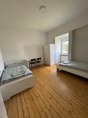 Ein Bett oder Betten in einem Zimmer der Unterkunft Monteurwohnung Neustadt Zentrum