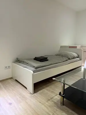 Ein Bett oder Betten in einem Zimmer der Unterkunft Monteur- und Ferienwohnung Neustadt an der Weinstraße