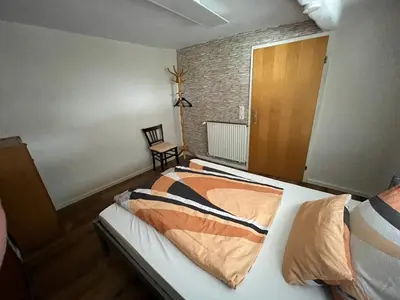 Ein Bett oder Betten in einem Zimmer der Unterkunft Jakobsruhe - Ferien im Weinparadies