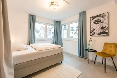 Ein Bett oder Betten in einem Zimmer der Unterkunft Studio Bergstrasse 2 PAX NEU Parkplatz