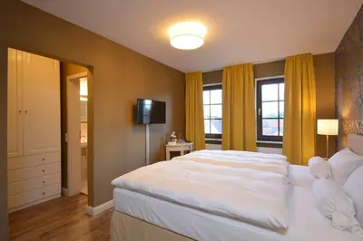 Ein Bett oder Betten in einem Zimmer der Unterkunft Hotel am Kirchplatz