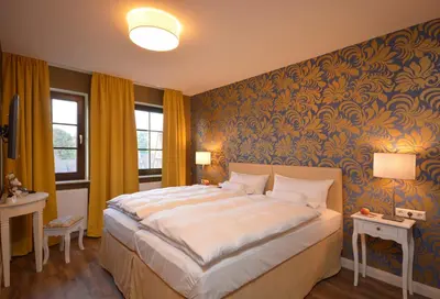 Ein Bett oder Betten in einem Zimmer der Unterkunft Hotel am Kirchplatz