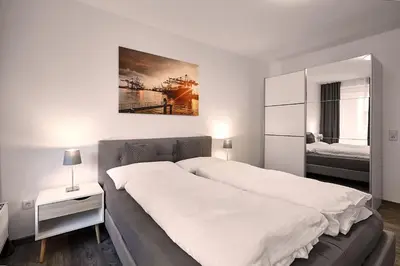 Ein Bett oder Betten in einem Zimmer der Unterkunft LIV Design Apartments Ettlingen-Zentrum