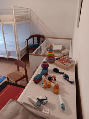 Ein Bett oder Betten in einem Zimmer der Unterkunft Kinderfreundliche Wohnung