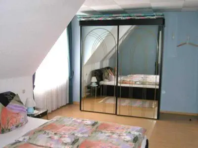 Ein Bett oder Betten in einem Zimmer der Unterkunft Ferienwohnung Lioba Kunst