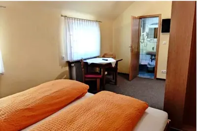 Ein Bett oder Betten in einem Zimmer der Unterkunft Gasthaus Zum Spalterwald
