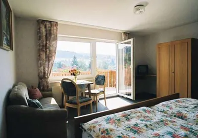 Ein Bett oder Betten in einem Zimmer der Unterkunft Gasthaus Zum Spalterwald
