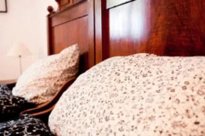 Ein Bett oder Betten in einem Zimmer der Unterkunft Ferienwohnungen Elsbacher Hof