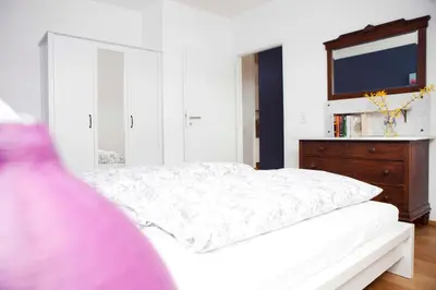Ein Bett oder Betten in einem Zimmer der Unterkunft Ferienwohnungen Elsbacher Hof