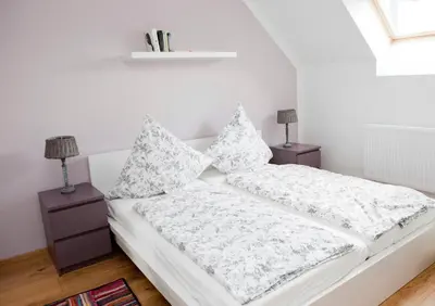 Ein Bett oder Betten in einem Zimmer der Unterkunft Ferienwohnungen Elsbacher Hof