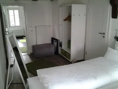 Ein Bett oder Betten in einem Zimmer der Unterkunft Malerwinkel & Tuchereck