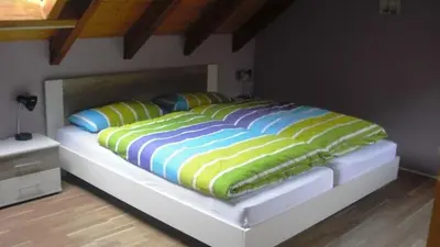 Ein Bett oder Betten in einem Zimmer der Unterkunft Ferienwohnung Kuhn