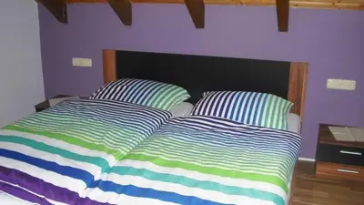 Ein Bett oder Betten in einem Zimmer der Unterkunft Ferienwohnung Kuhn