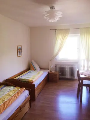 Ein Bett oder Betten in einem Zimmer der Unterkunft Ferienhof Christmann