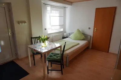 Ein Bett oder Betten in einem Zimmer der Unterkunft Haus am Mühlberg