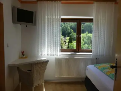 Ein Bett oder Betten in einem Zimmer der Unterkunft Pension Holzerstube