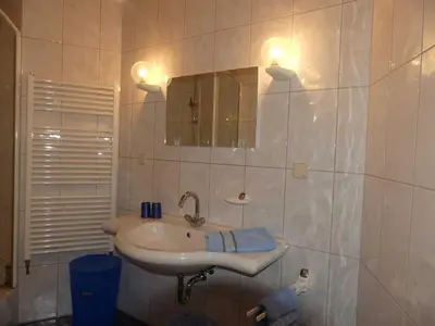 Ein Badezimmer in der Unterkunft Pension Holzerstube