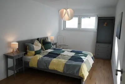 Ein Bett oder Betten in einem Zimmer der Unterkunft Ferienwohnungen Rosengarten