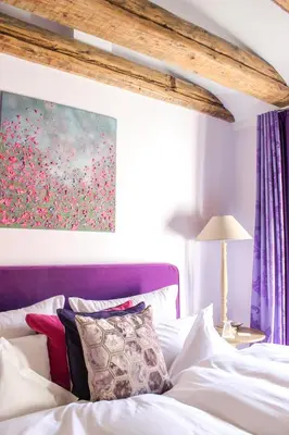 Ein Bett oder Betten in einem Zimmer der Unterkunft Gästehaus im Weingut am Nil