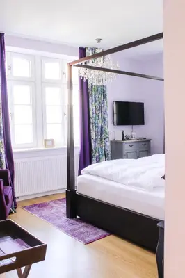 Ein Bett oder Betten in einem Zimmer der Unterkunft Gästehaus im Weingut am Nil