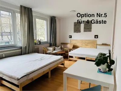 Ein Bett oder Betten in einem Zimmer der Unterkunft UrbanPause Studio KA-Mitte