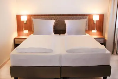 Ein Bett oder Betten in einem Zimmer der Unterkunft Anor Hotel & Conference Center Frankfurt Airport