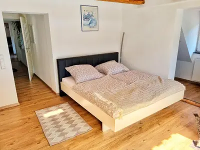 Ein Bett oder Betten in einem Zimmer der Unterkunft Alte Fachwerkresidenz